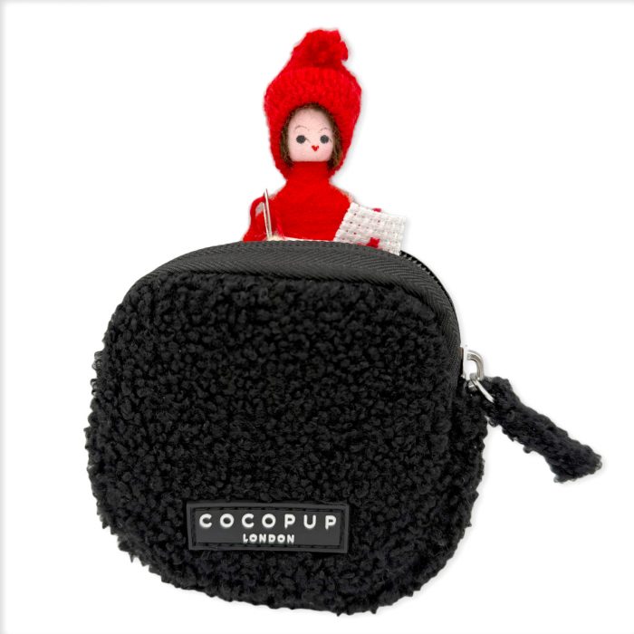 Cocopup Teddy Treat Pouch in black shown with a small toy figure inside, demonstrating pouch size.