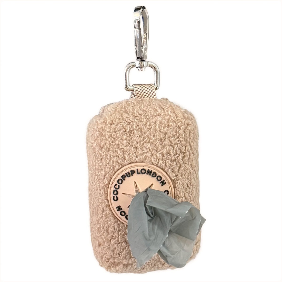 CP-DOG-003_Poop Bag Rupert copy Cocopup London Teddy Poop Bag Holder Rupert in beige fluffy teddy fabric with zip and metal clip, shown on a white background with a grey waste bag pulled through the dispenser.