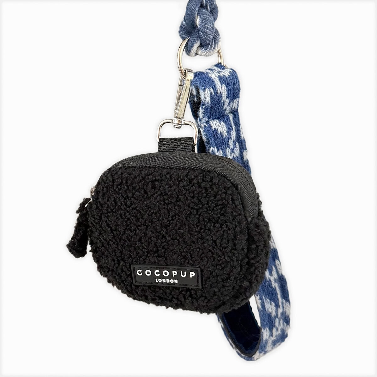 CP-PET-0001_TeddyBaloo_Image copy Cocopup London Teddy Treat Pouch Baloo in black fluffy fabric, clipped to a black dog lead, shown in a lifestyle image.