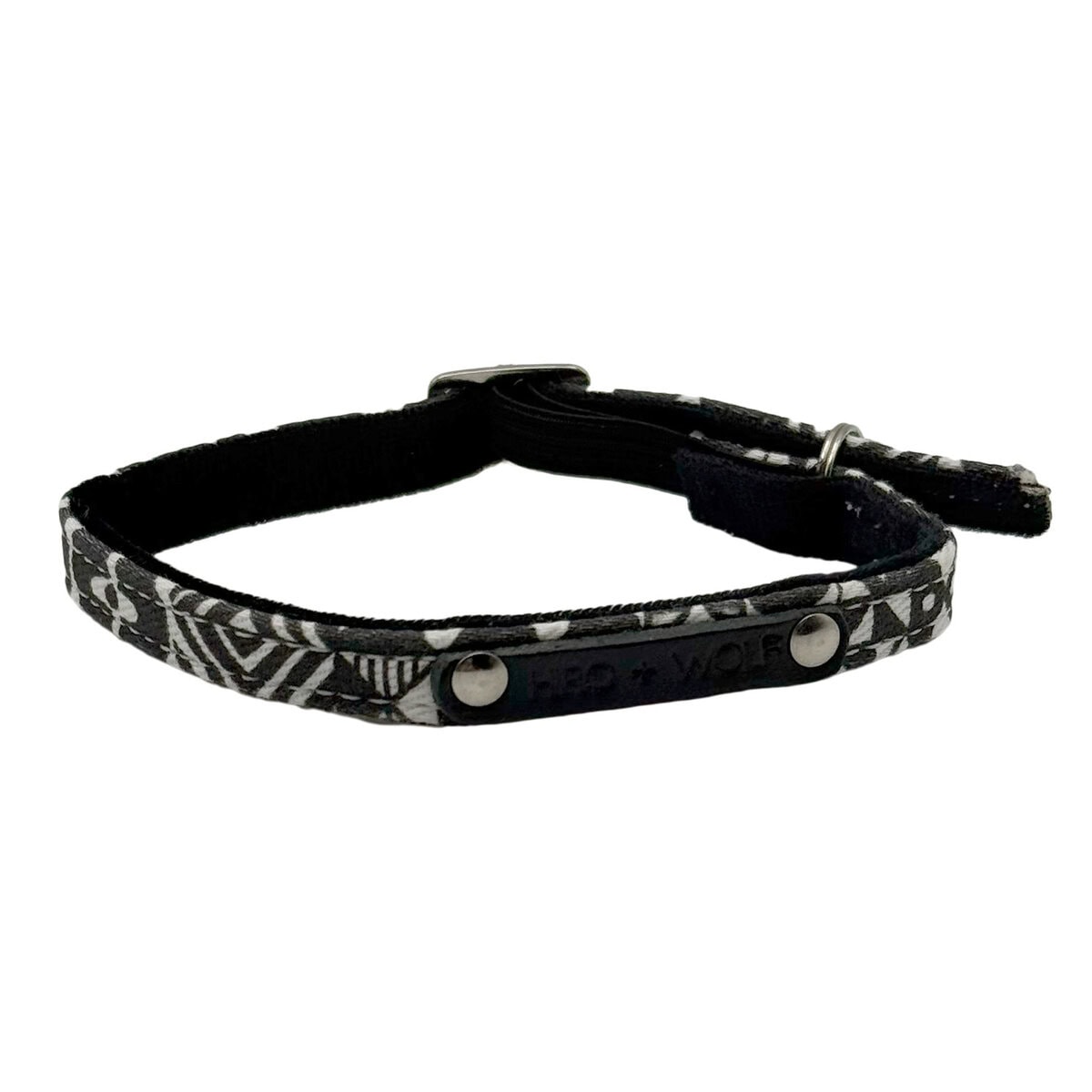 HW-CAT-0001_Strech Cat collar_Front copy Hiro + Wolf Bow Wow Haus Stretch Cat Collar in black and white geometric print, featuring an adjustable buckle and safety bell, shown on a white background, Back view.