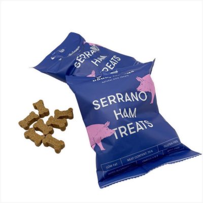 Two blue Buddylicious Serrano Ham Treats bags with bone-shaped semi-moist treats on white background – natural, hypoallergenic, and rich in omega oils – EdenWave.
