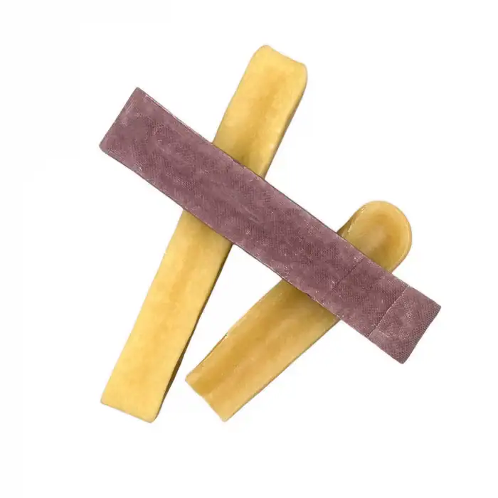 Three K2 Yak Chews unwrapped — two natural and one blueberry flavour